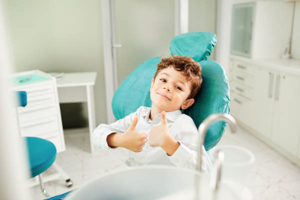 child in dental chair, green life dental Surrey bc